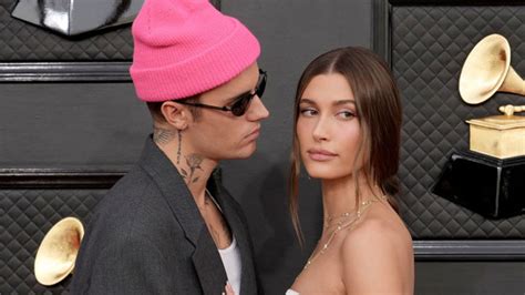 Hailey Bieber wows in silky wedding dress alongside .